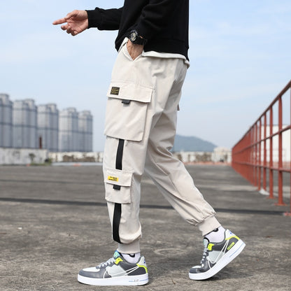 Pantalones harén con cintas casuales y múltiples bolsillos