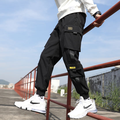 Pantalones harén con cintas casuales y múltiples bolsillos